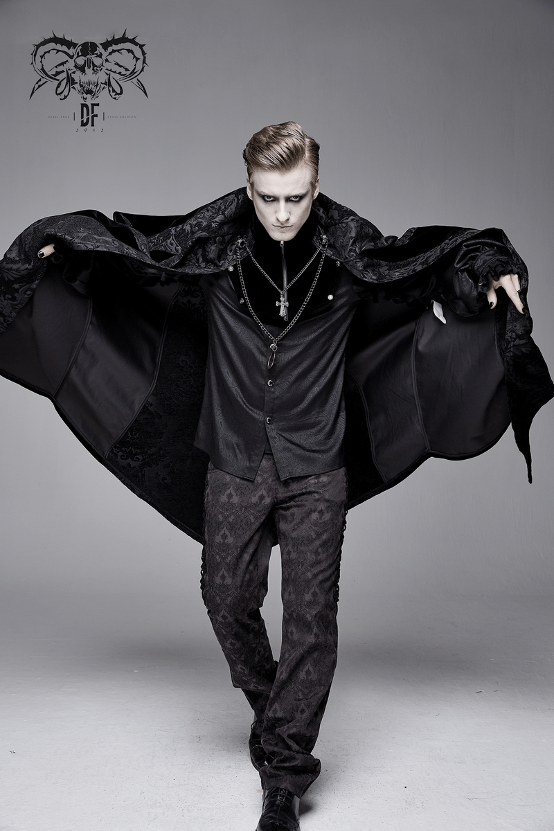 Stylish male model in a black long gothic cloak with stand-up collar, showcasing elegance and mystique.