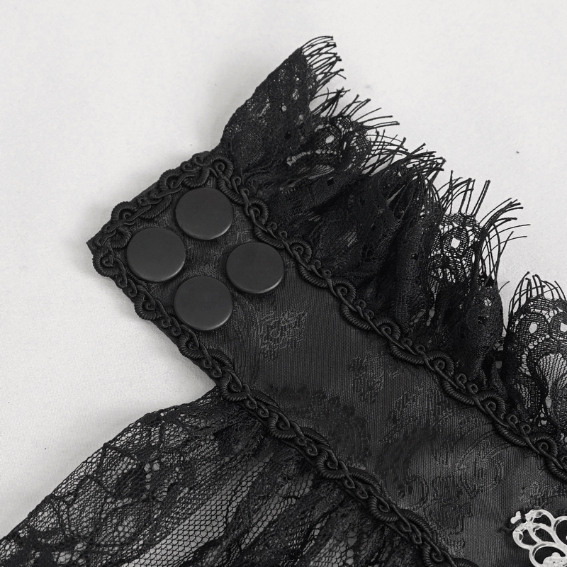 Close-up of a black lace necktie with ruffled edges and button back, showcasing gothic elegance and retro style.