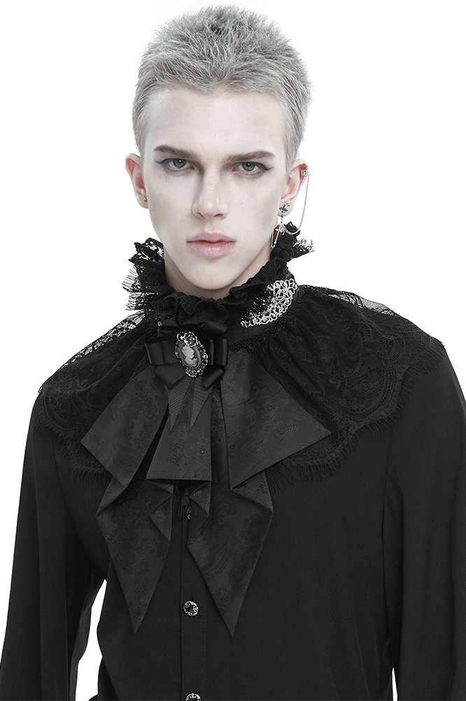 Male model in black Gothic style outfit featuring a lace ruffle bow tie and stand collar for retro elegance.
