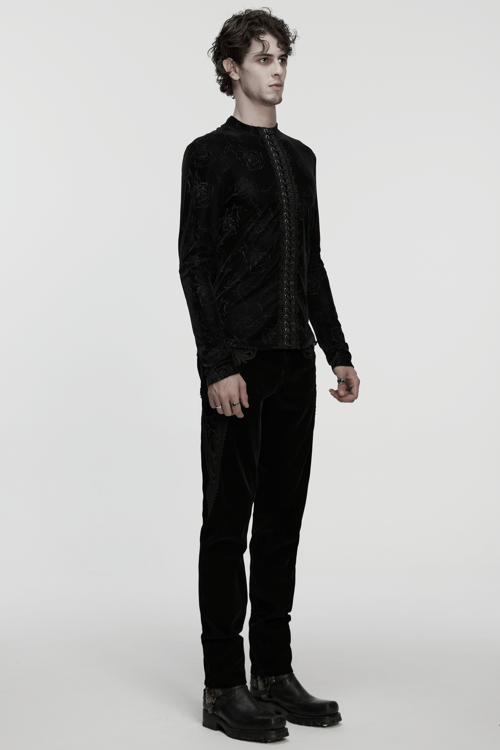 Male Black Rose Embossed Velvet Top with Long Sleeves worn by a model in a minimalist setting.