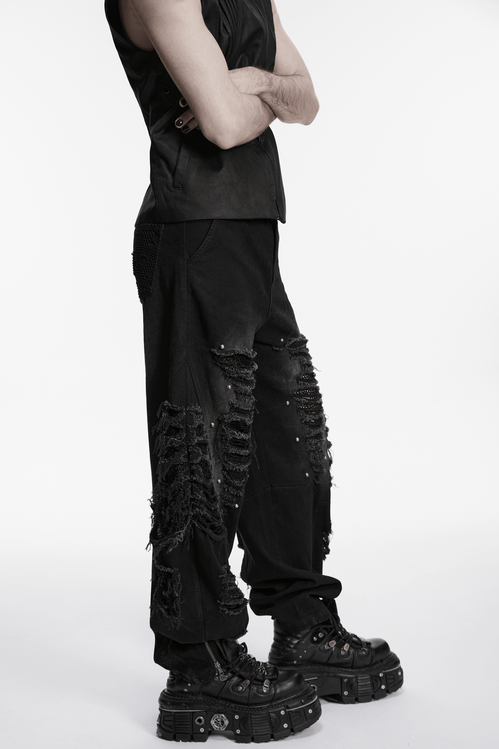 Male Bold Punk Distressed Denim Pants with Studded Rips showcased on model, featuring tattered design and bold style.
