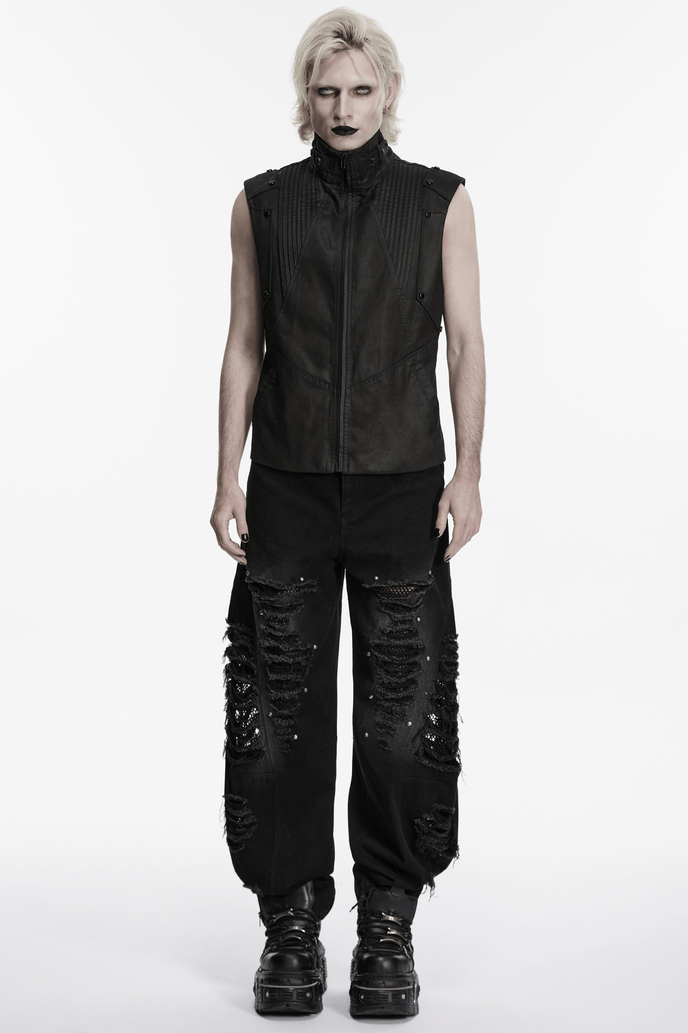 Male Bold Punk Distressed Denim Pants with Studded Rips worn by a model in a black vest and dramatic styling.