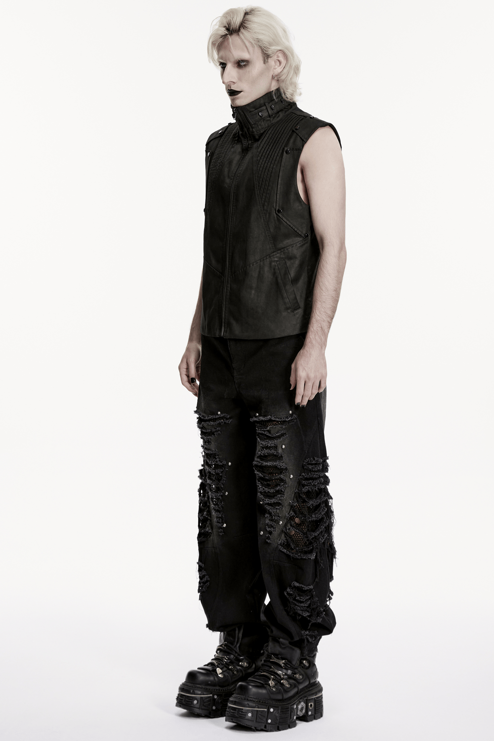 Male Bold Punk Distressed Denim Pants with Studded Rips worn by a model in a striking outfit.
