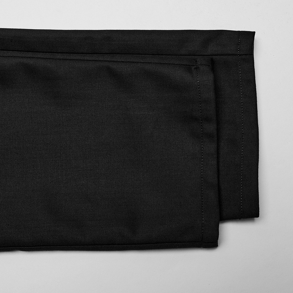 Close-up of black minimalist cargo trousers showcasing stylish side pockets and refined fabric texture.