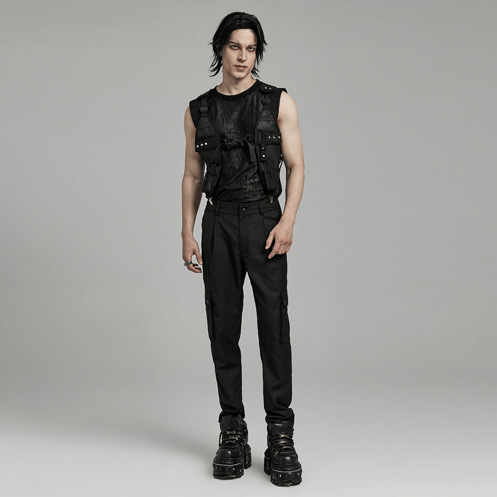Male model in black chic minimalist cargo trousers with side pockets and stylish footwear, showcasing modern urban fashion.