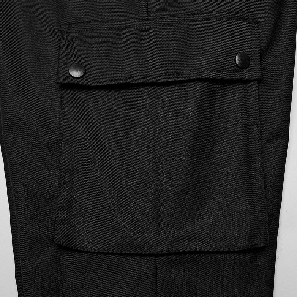 Close-up of side pocket on black minimalist cargo trousers for men, showcasing stylish and practical design.