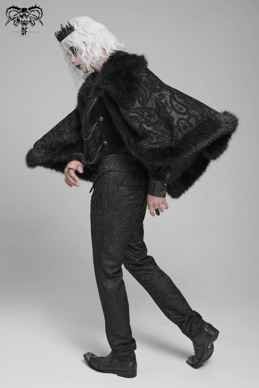 Male Gothic Cape with Faux Fur Collar and Hem Trim worn by a model, showcasing dark brocade and flowing sleeves.