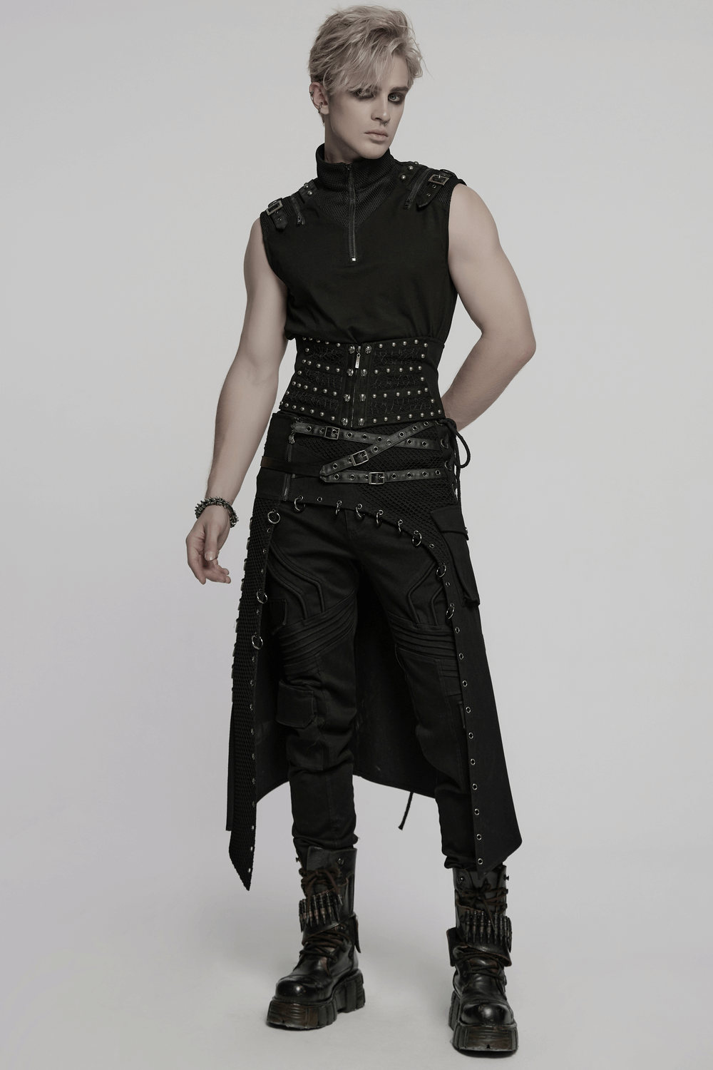 Male model showcasing a gothic punk corset belt with studs and a striking layered black outfit.