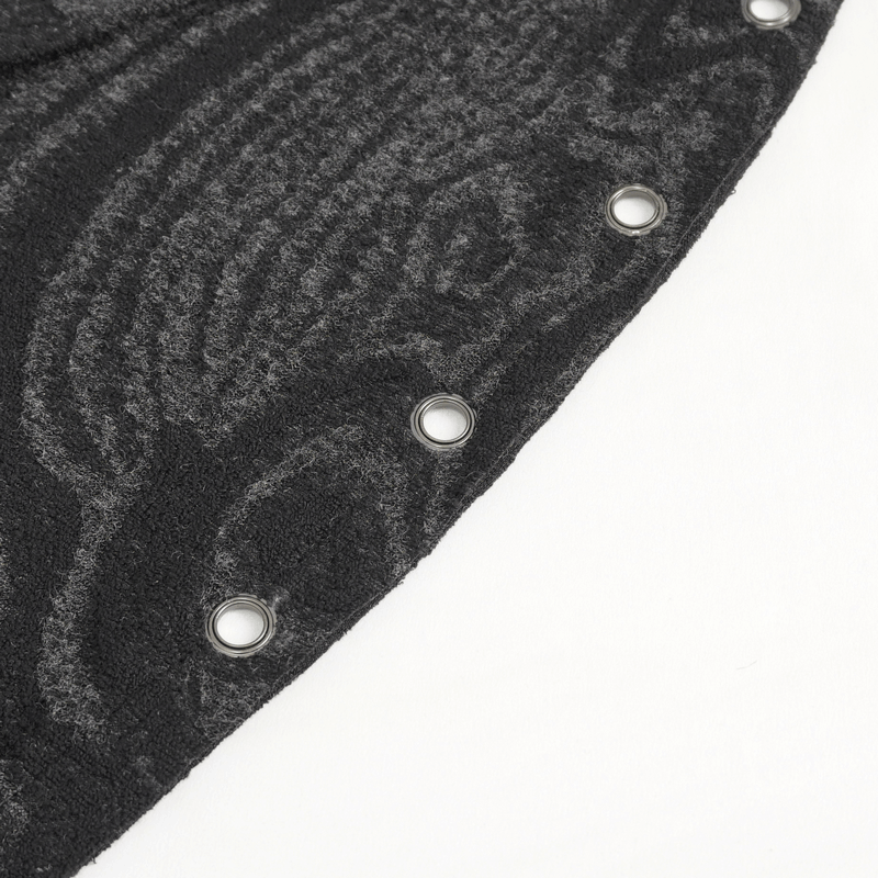Close-up of a black fabric with decorative eyelets, showcasing gothic style details for a unique design.