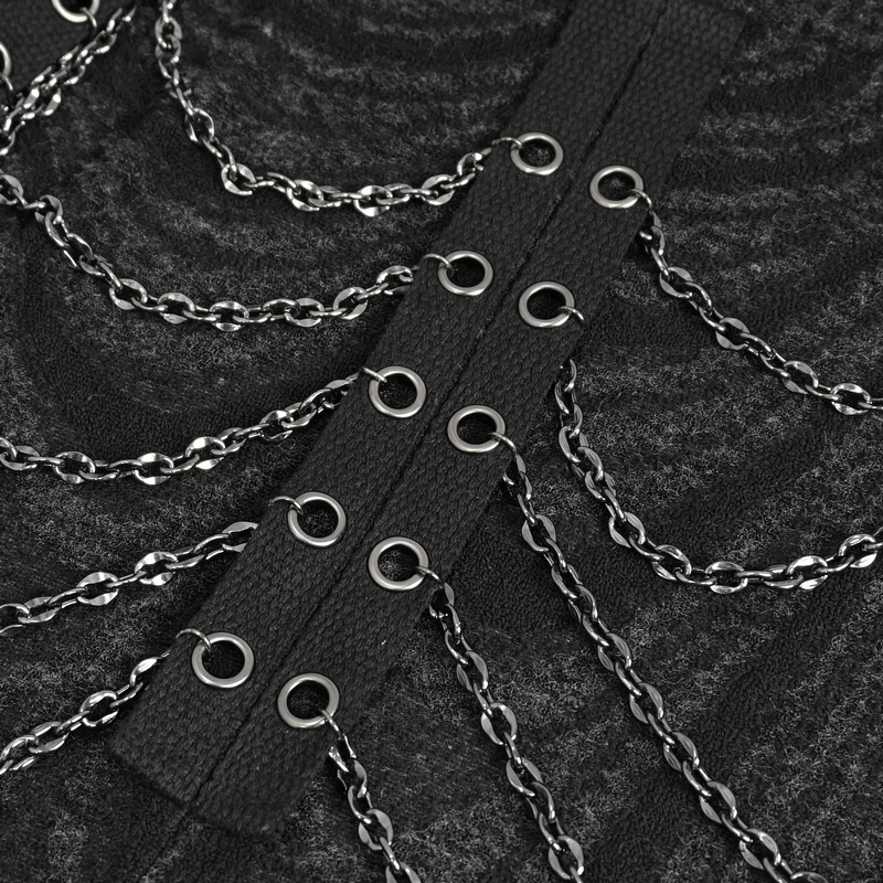 Close-up of black multi-chain detailing on a gothic hooded coat, showcasing unique alternative fashion style.