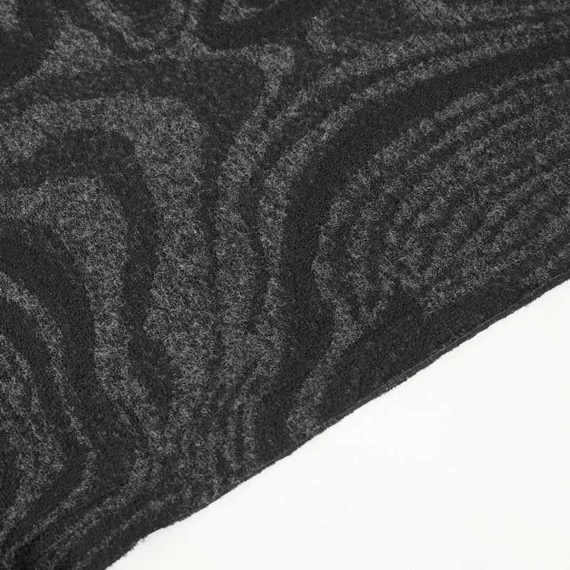 Textured black fabric close-up showcasing wavy patterns; perfect for gothic style apparel.