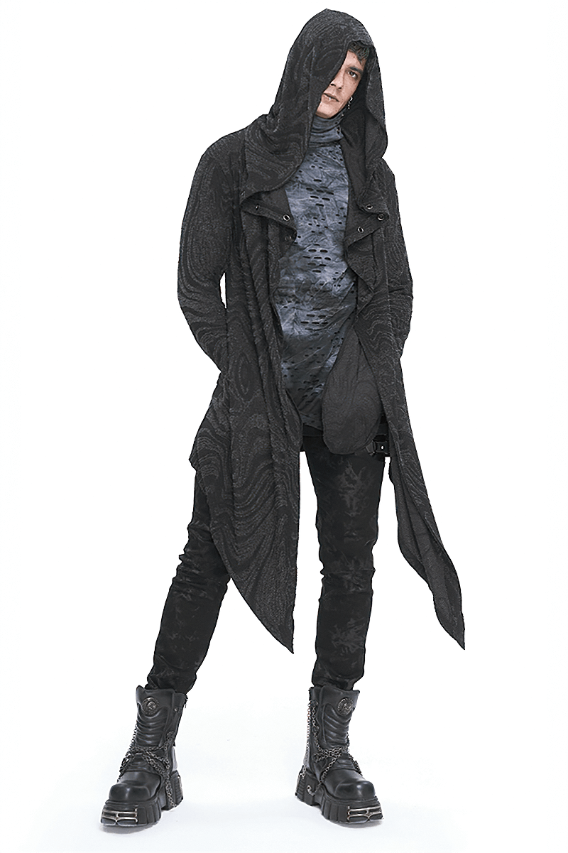 Male model in a gothic irregular hooded coat with chains, showcasing alternative fashion style.