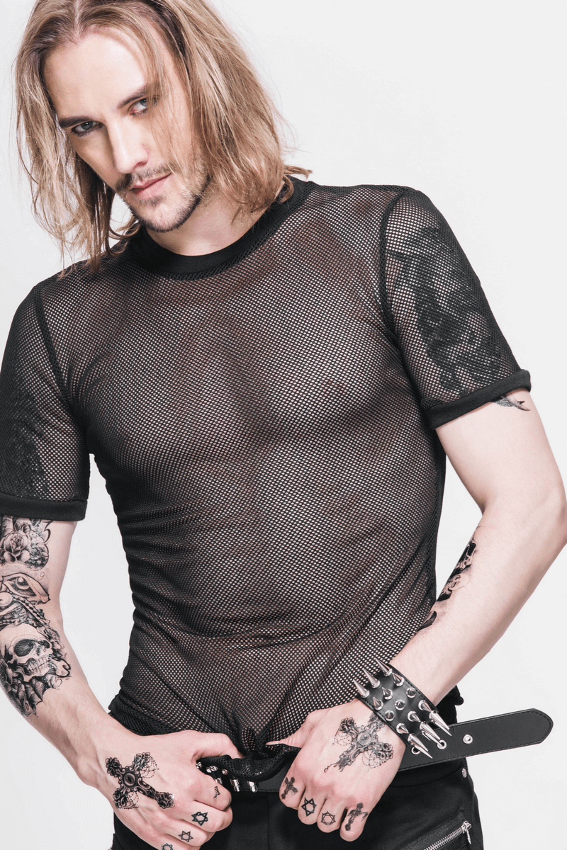 Stylish male model wearing a black gothic sheer mesh t-shirt, showcasing intricate tattoos and edgy accessories.
