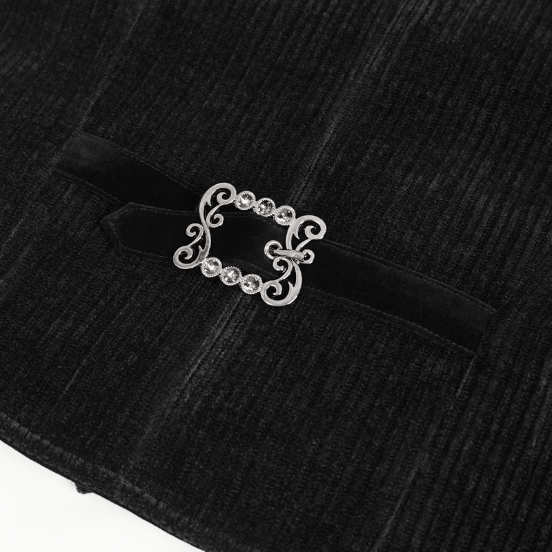 Close-up of a gothic velvet waistcoat clasp featuring intricate design and sparkling embellishments.