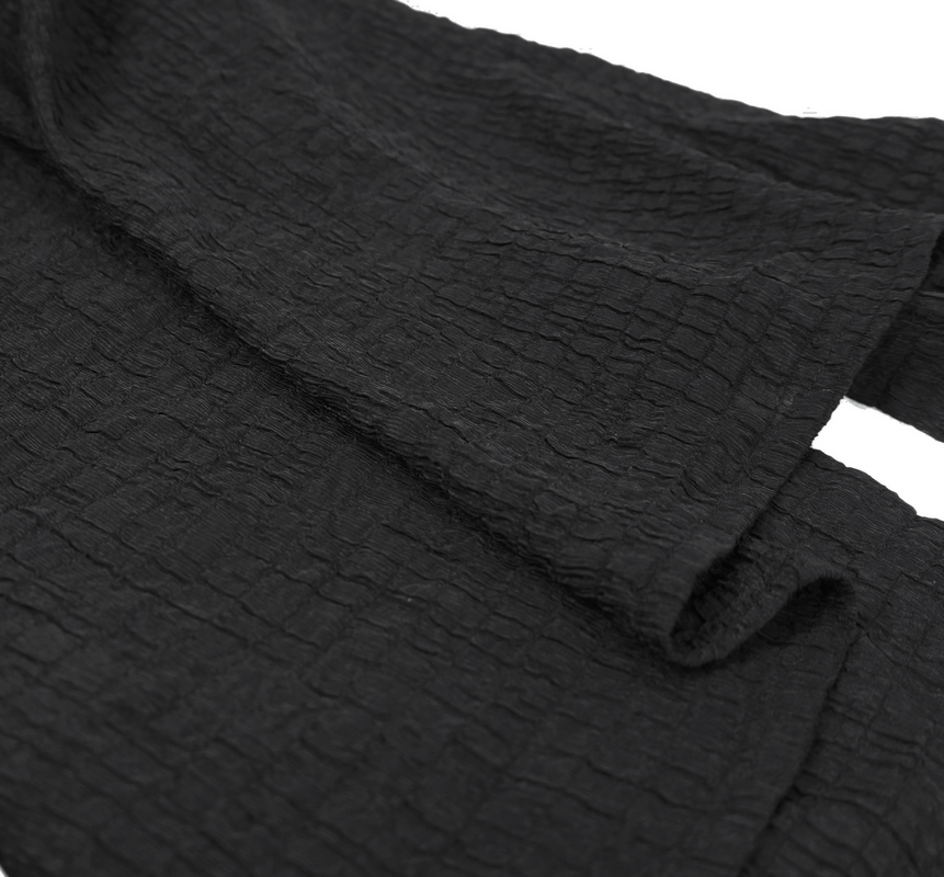 Textured black fabric with a crinkled finish, representing gothic vintage style for men's long sleeve shirts.