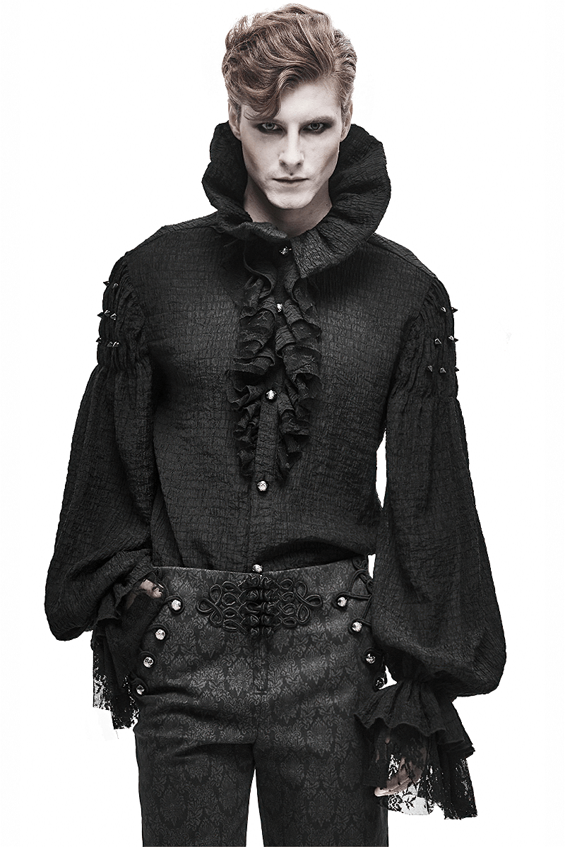 Stylish male model in a black gothic vintage shirt with ruffles and a stand collar, showcasing elegant fashion.
