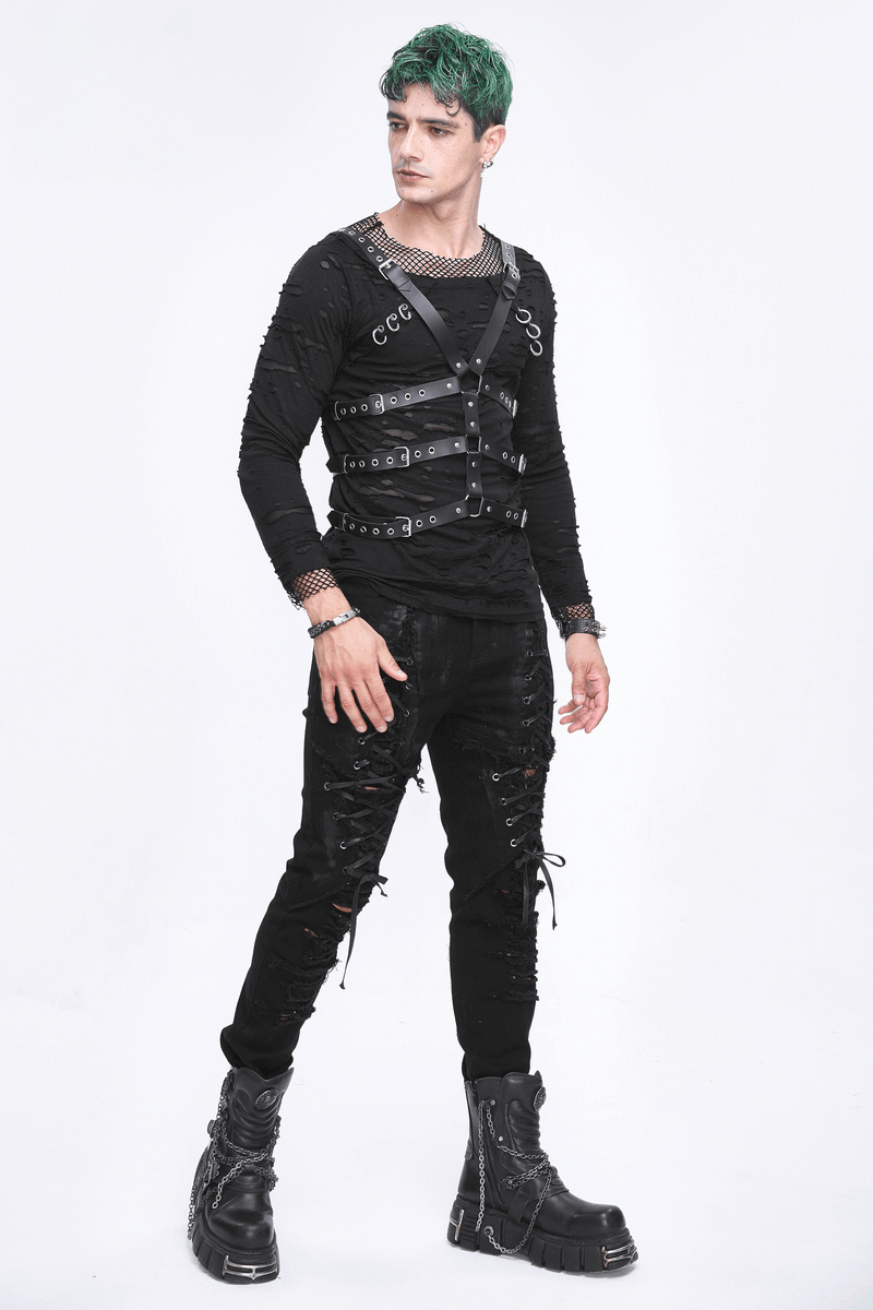 Punk-inspired male wearing a multi-buckle PU leather body harness with edgy black outfit and bold green hair.