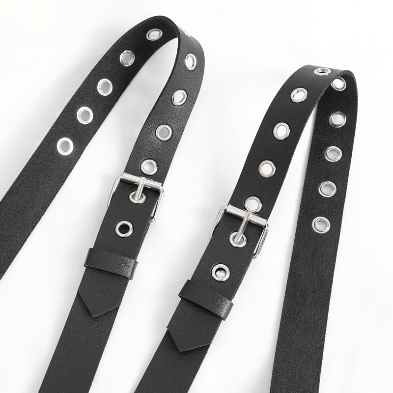 Close-up of black PU leather straps with silver buckles and eyelets, perfect for punk fashion.