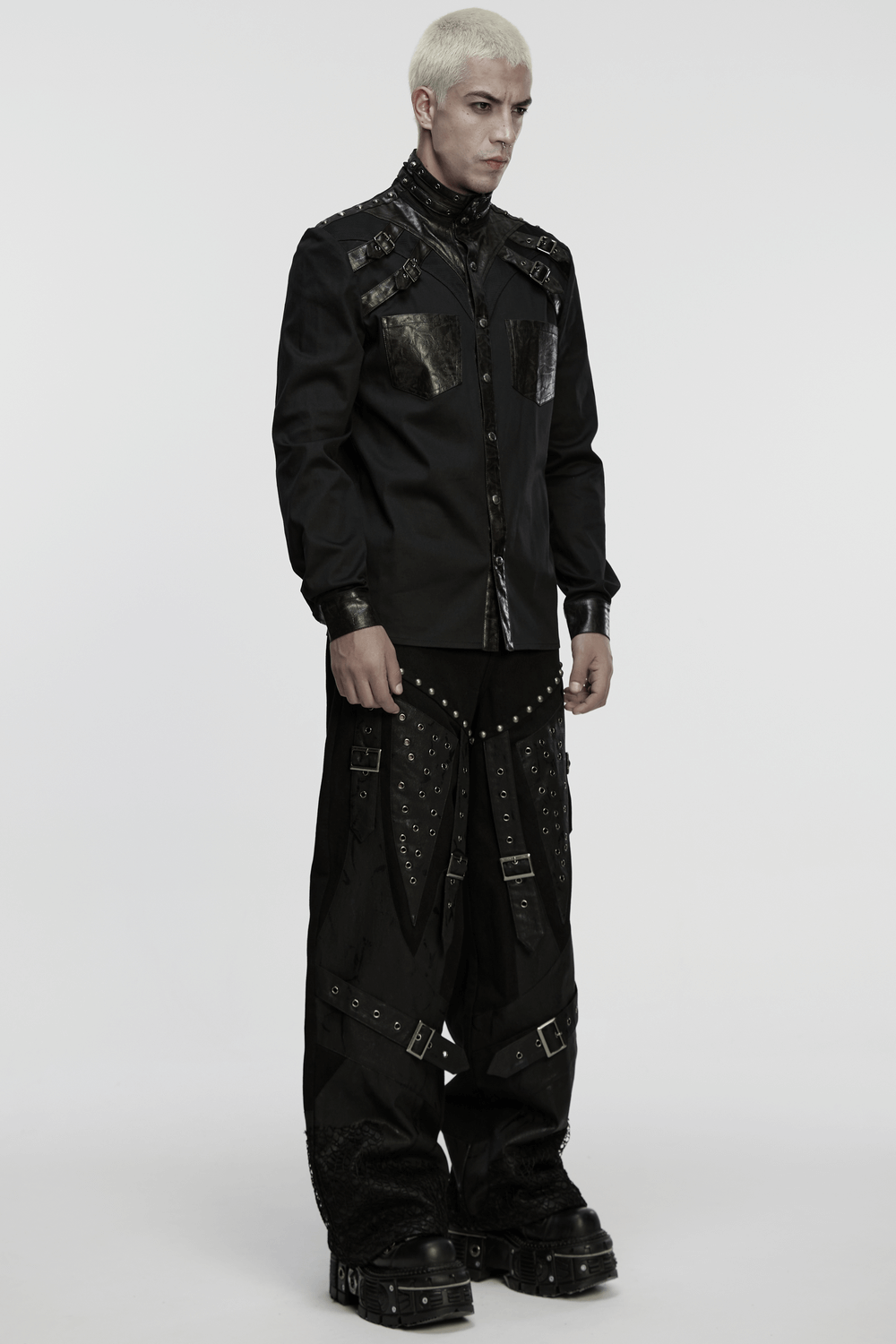 Male Punk Black Pants with Studs and Buckle Straps worn by a model showcasing edgy punk fashion.