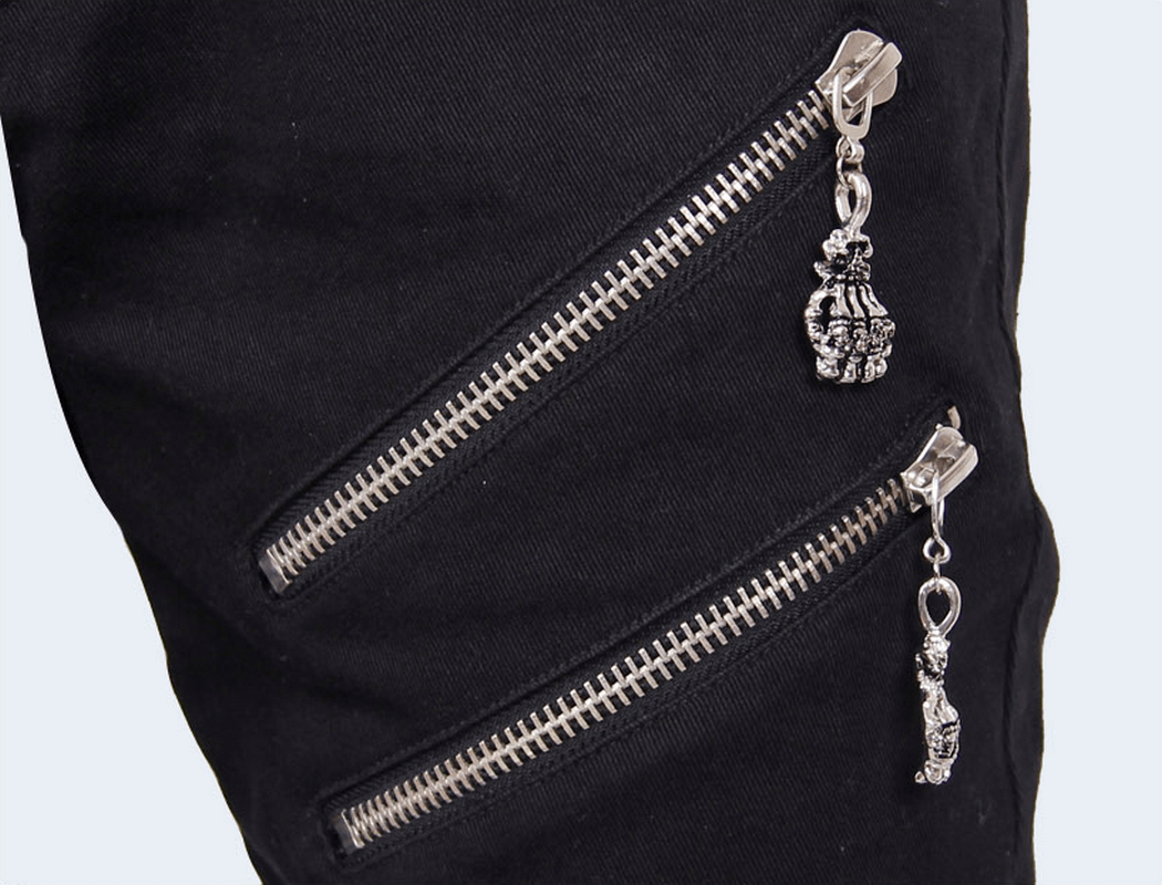 Close-up of black punk rock pants featuring silver zippers and decorative chains for a stylish look.