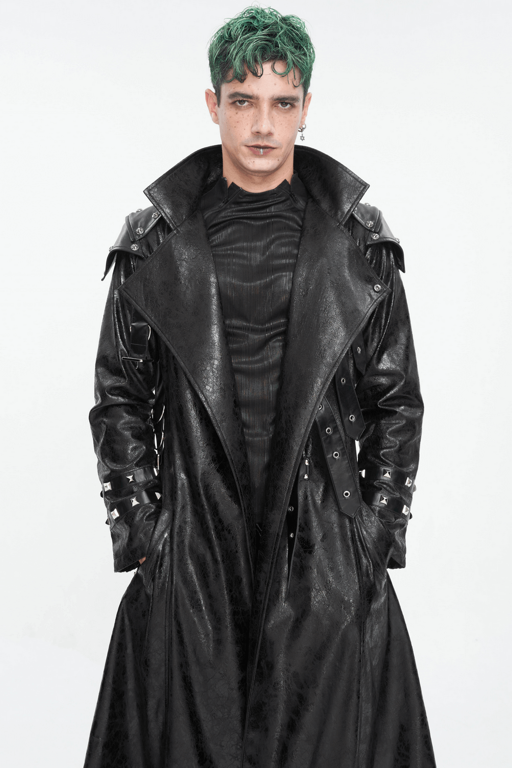 Male model in a punk stand collar faux leather coat with buckles, showcasing edgy fashion style.
