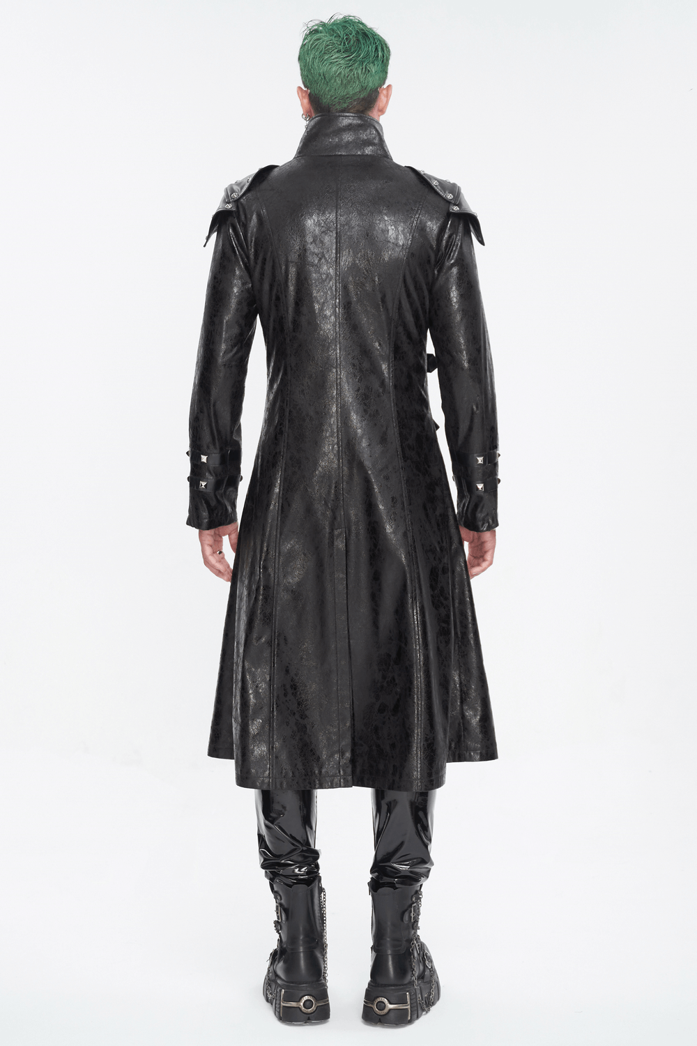 Back view of a male wearing a punk-style black faux leather coat with a stand collar and multi-buckle details.