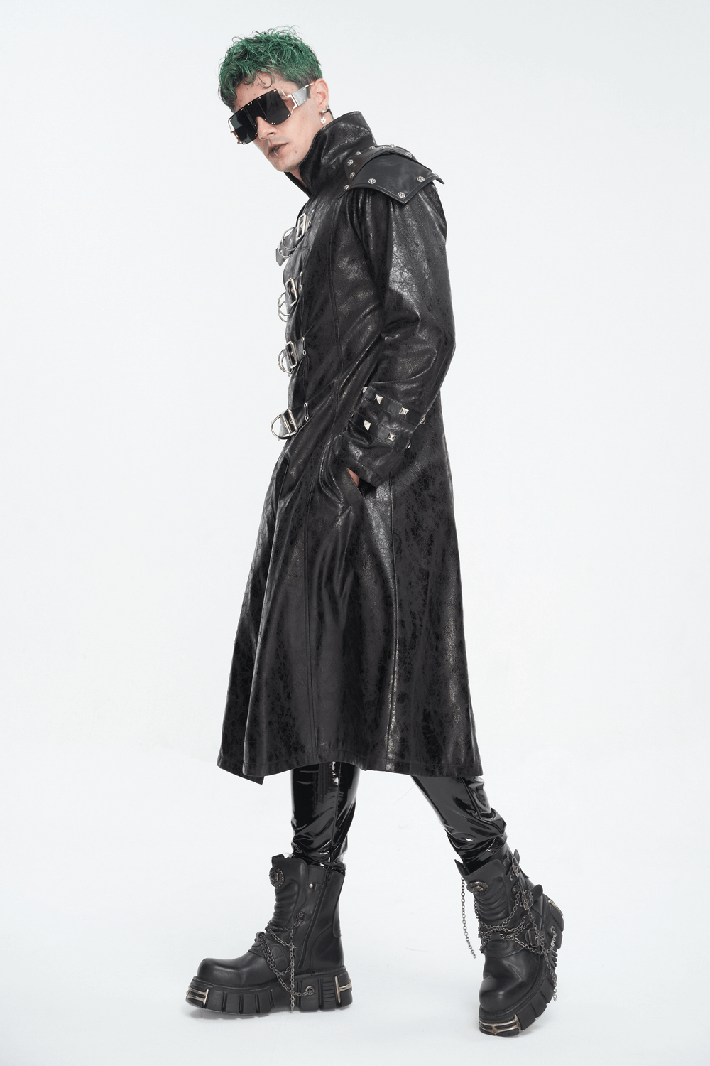 Male model showcasing a punk style faux leather coat with stand collar and multi-buckle details, exuding edgy fashion.