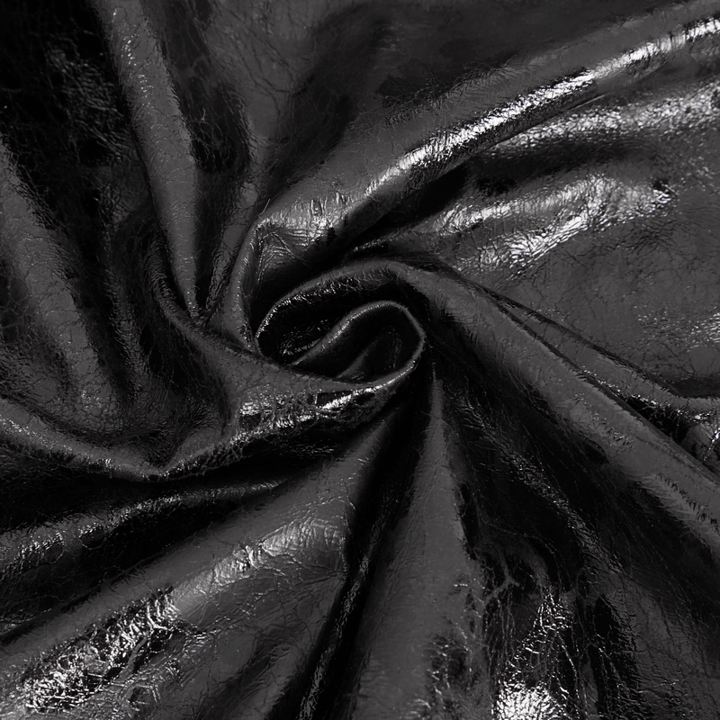Close-up of sleek black faux leather fabric, perfect for a bold punk fashion statement.