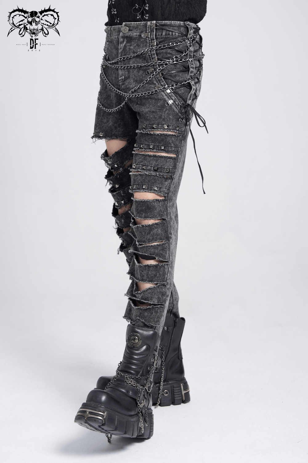 Male ripped legs gothic pants with chains and studs, featuring distressed denim and lace-up sides.