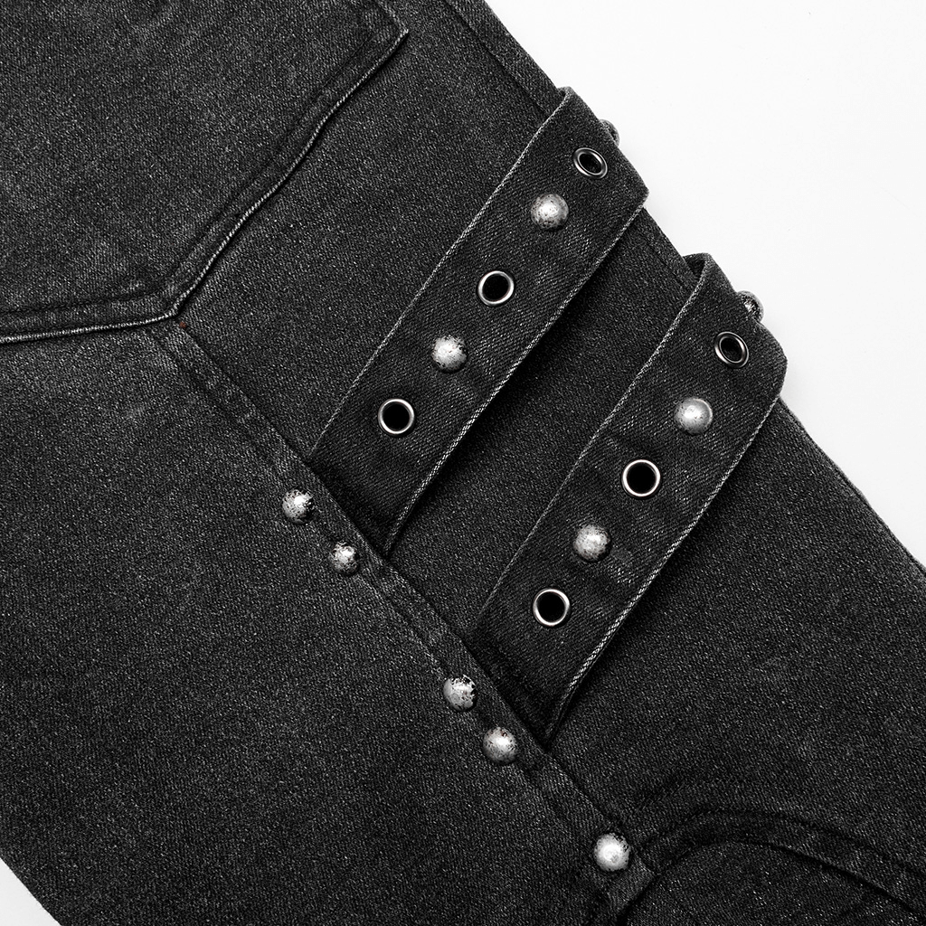 Close-up of rugged denim cargo pants featuring edgy knee patches and decorative loops for a post-apocalyptic style.