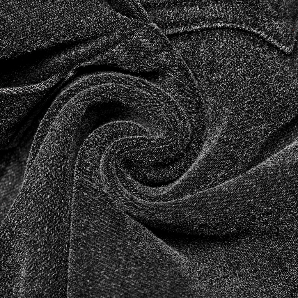 Close-up of black rugged denim fabric, showcasing its texture and durability for stylish cargo pants.