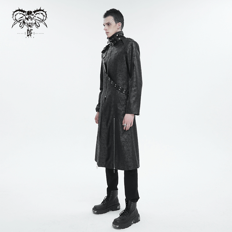 Male model in a stylish black stand collar split coat with a detachable strap, showcasing edgy trench coat design.