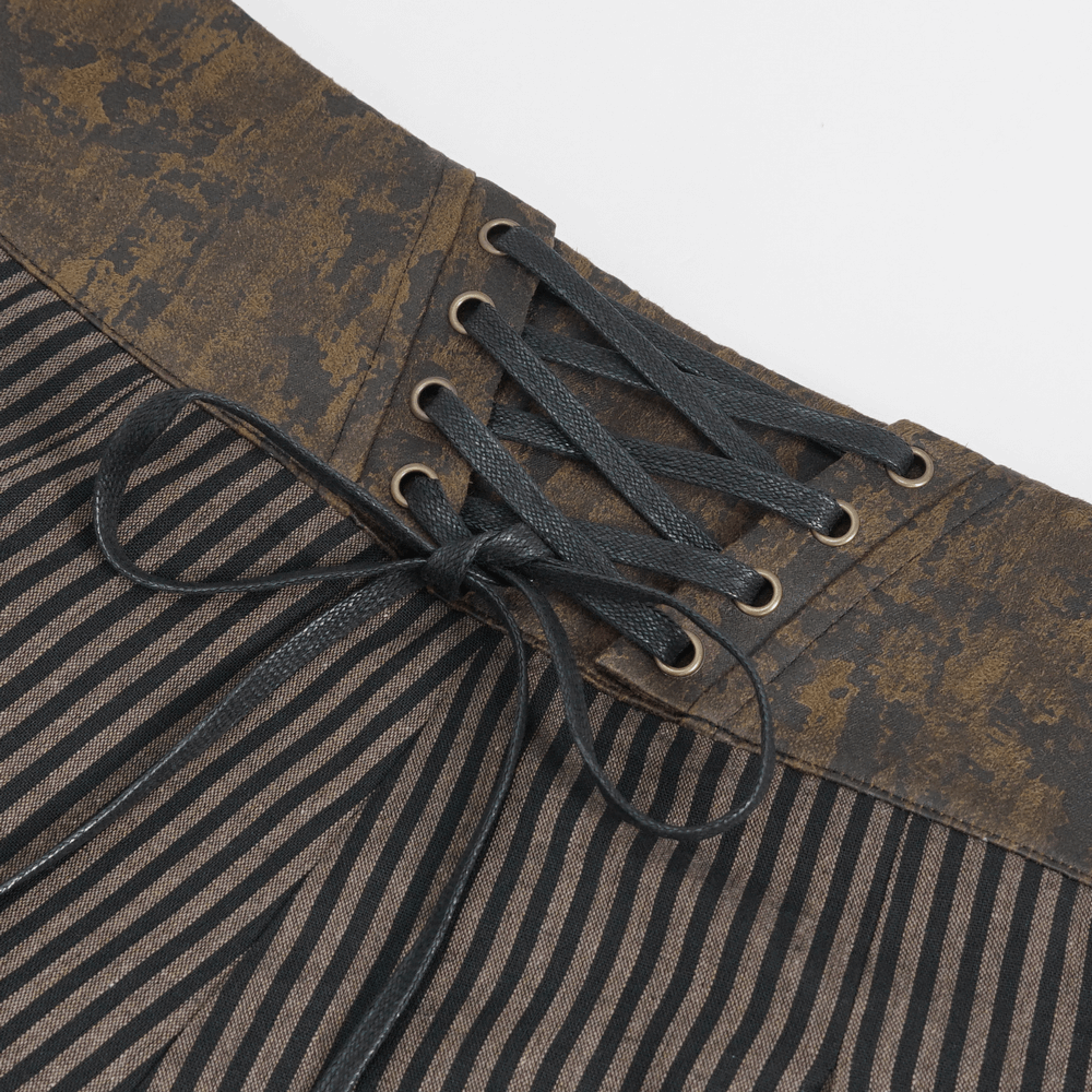 Close-up of male striped high-waist trousers featuring a textured waistband and lace-up detail.