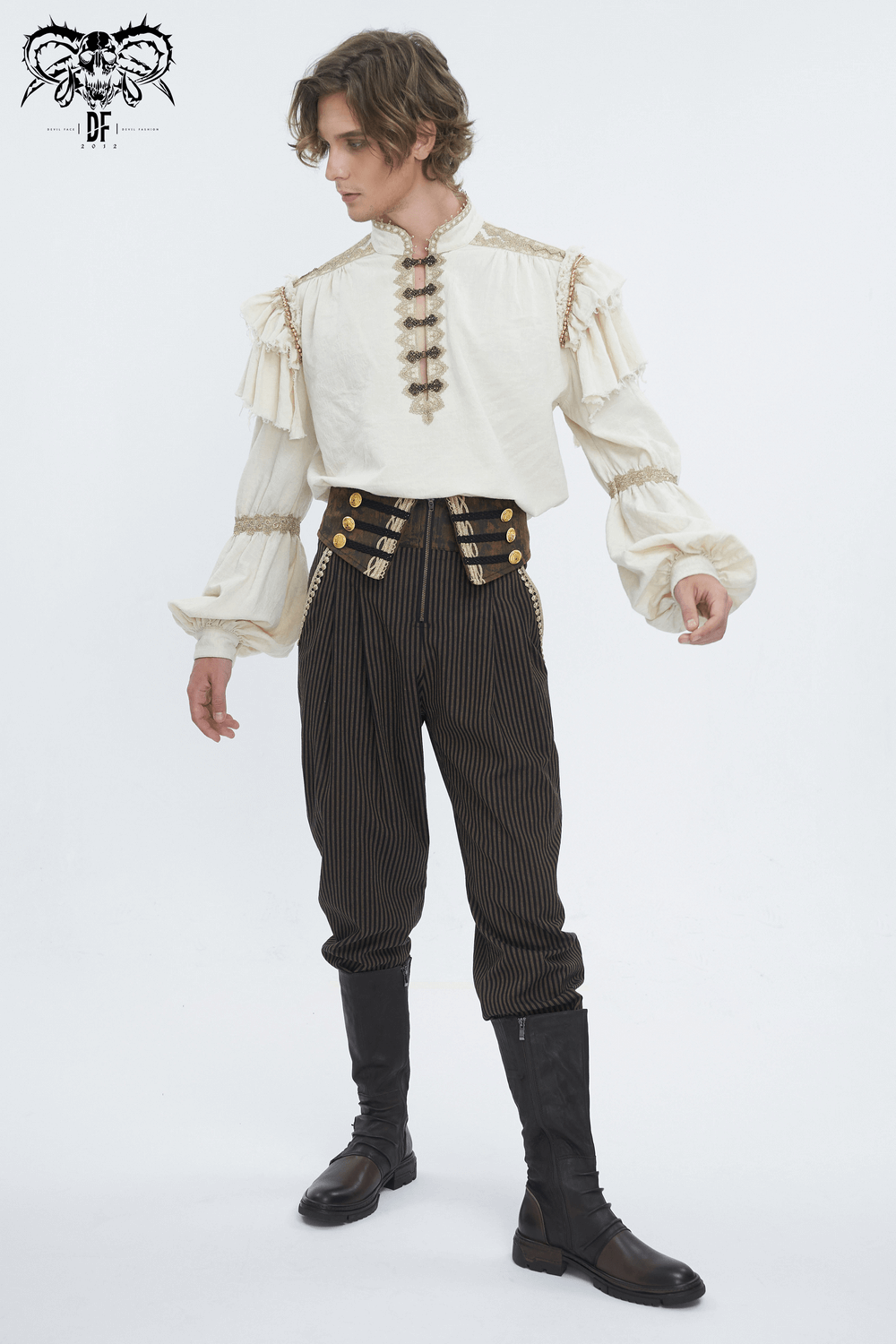 Male model in ruffled white shirt and striped high-waist trousers with button accents, showcasing a stylish look.