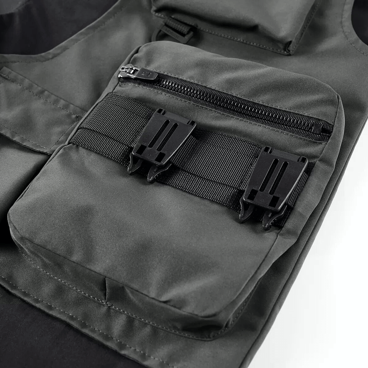 Close-up of tactical multi-pocket design showcasing zippers and strap details for functionality.