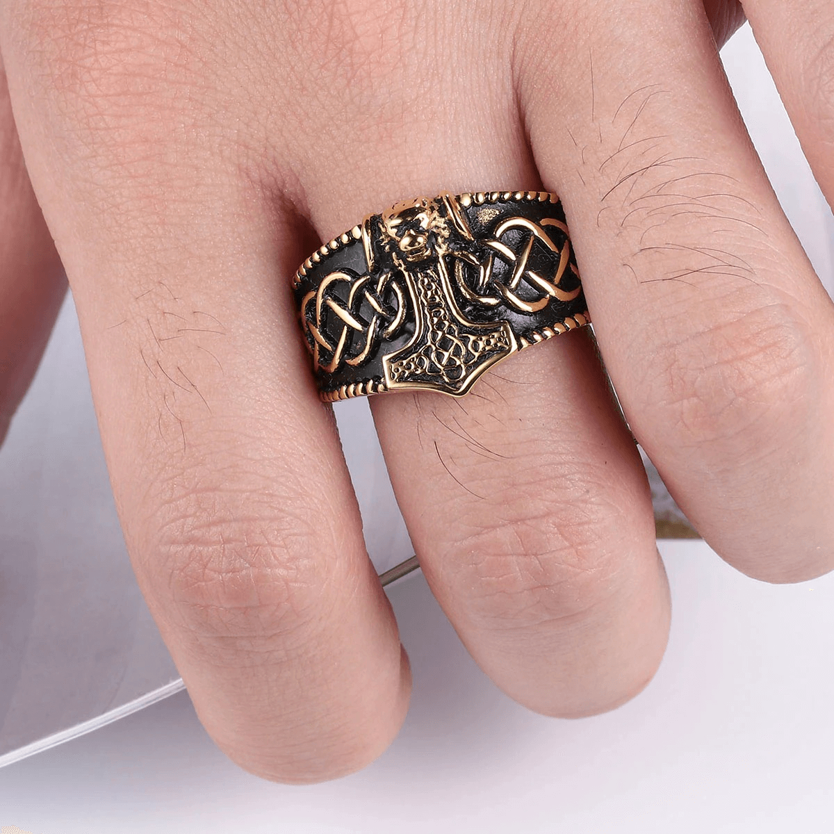 Vintage men's punk-style Thor's Hammer Celtic ring in stainless steel, showcased on a hand, perfect for stylish outfits.