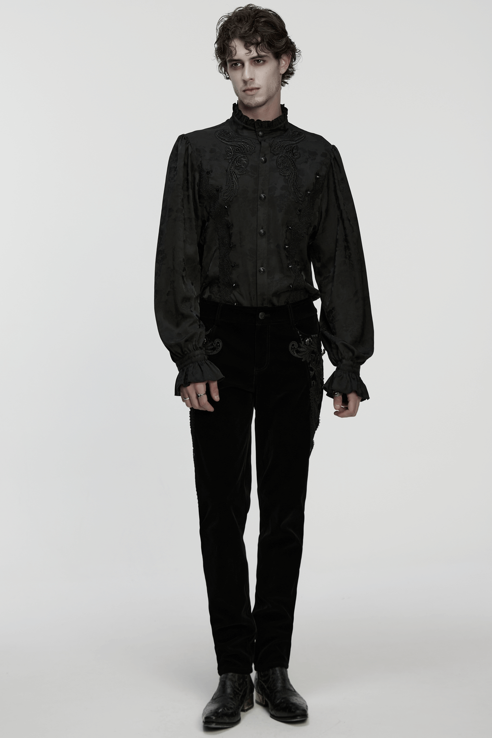 Male Velvet Pants with Lace and Gemstone Buttons worn with an embroidered black top, showcasing gothic fashion style.