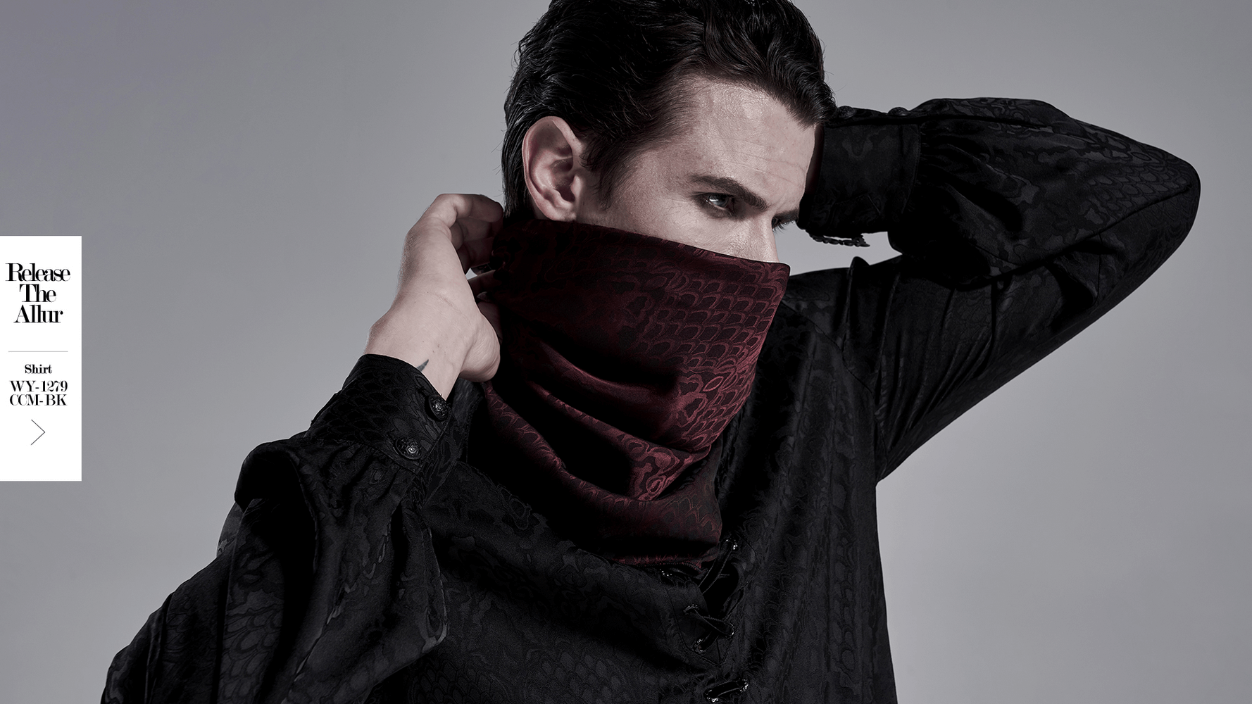 Male model wearing a wine-red gothic jacquard triangular bandana, styled with a dramatic black shirt.