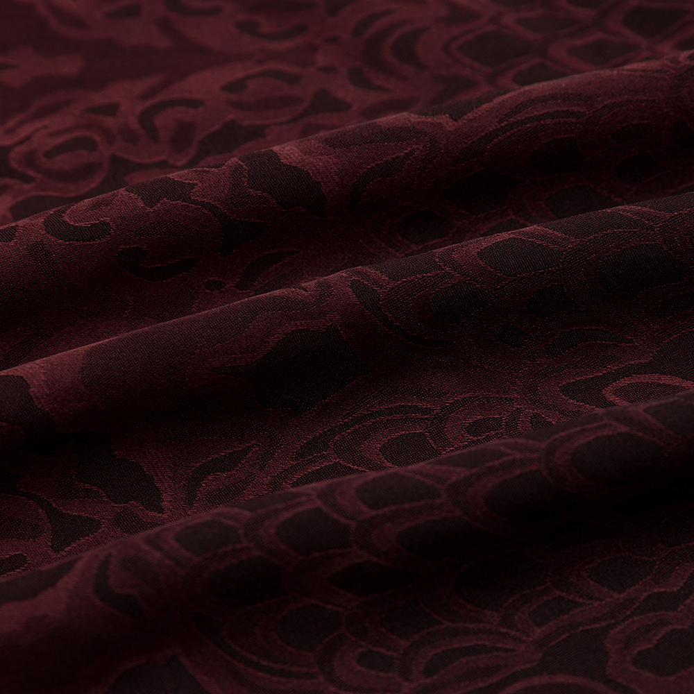 Close-up of wine-red gothic jacquard fabric with intricate patterns, ideal for bandanas and scarves.