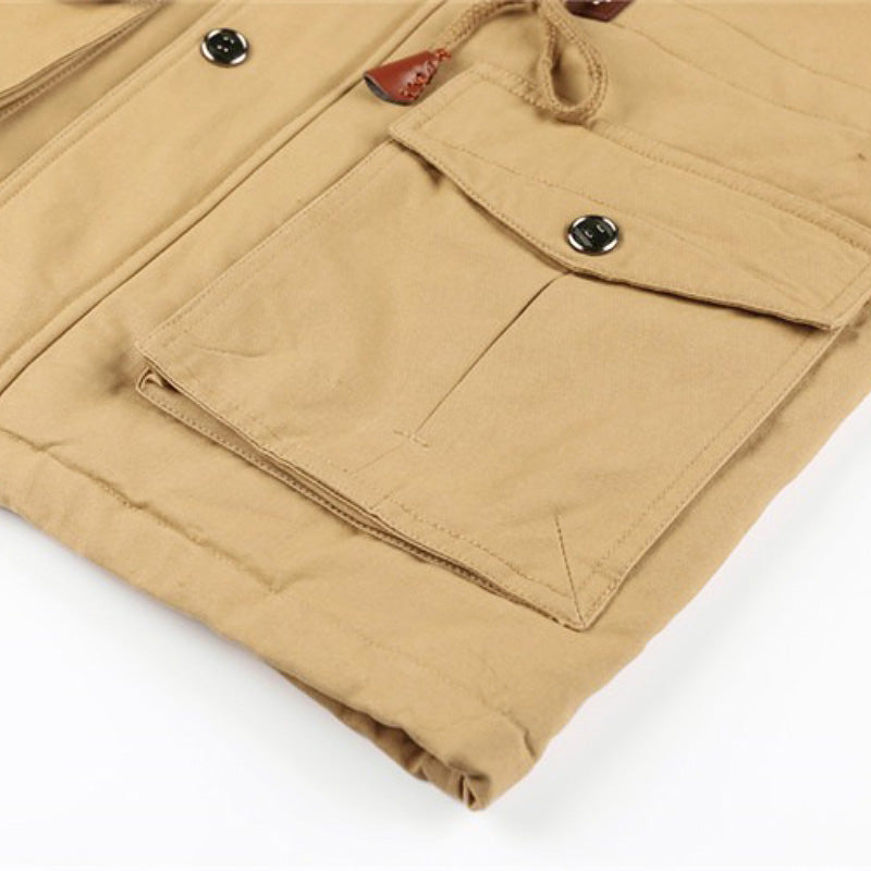 Close-up of khaki male winter fleece jacket with buttoned pockets, showcasing stylish and functional design.