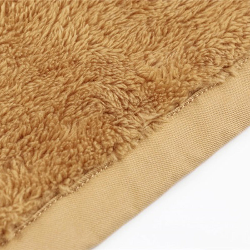 Close-up of warm, soft fleece fabric in a rich tan color, perfect for winter jackets for men.