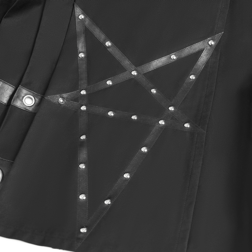 Close-up of black maxi skirt featuring pentagram straps and grommet details, showcasing edgy style and unique design.