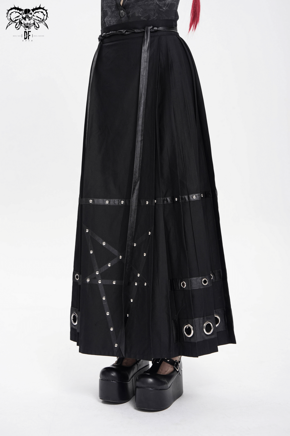 Stylish maxi skirt featuring pentagram straps and grommet details, perfect for a bold, edgy fashion statement.