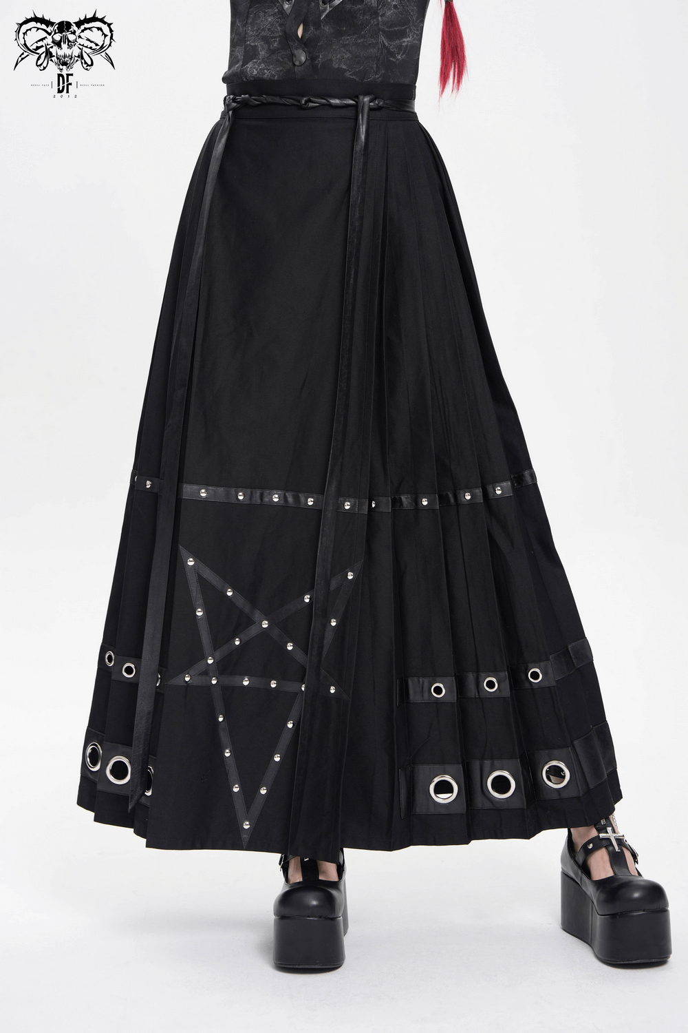 Stylish black maxi skirt featuring pentagram straps and edgy grommet details, perfect for alternative fashion.