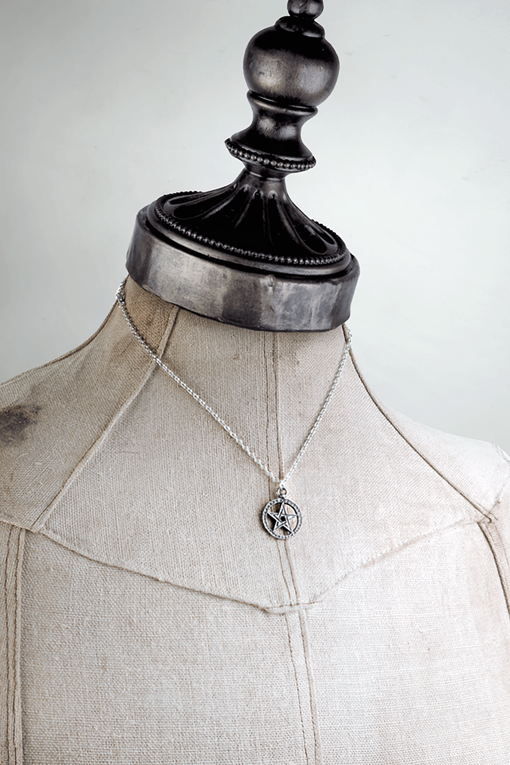 Medieval Style Dante's Hex Pentagram Pendant on a dress form, showcasing its timeless pewter design.