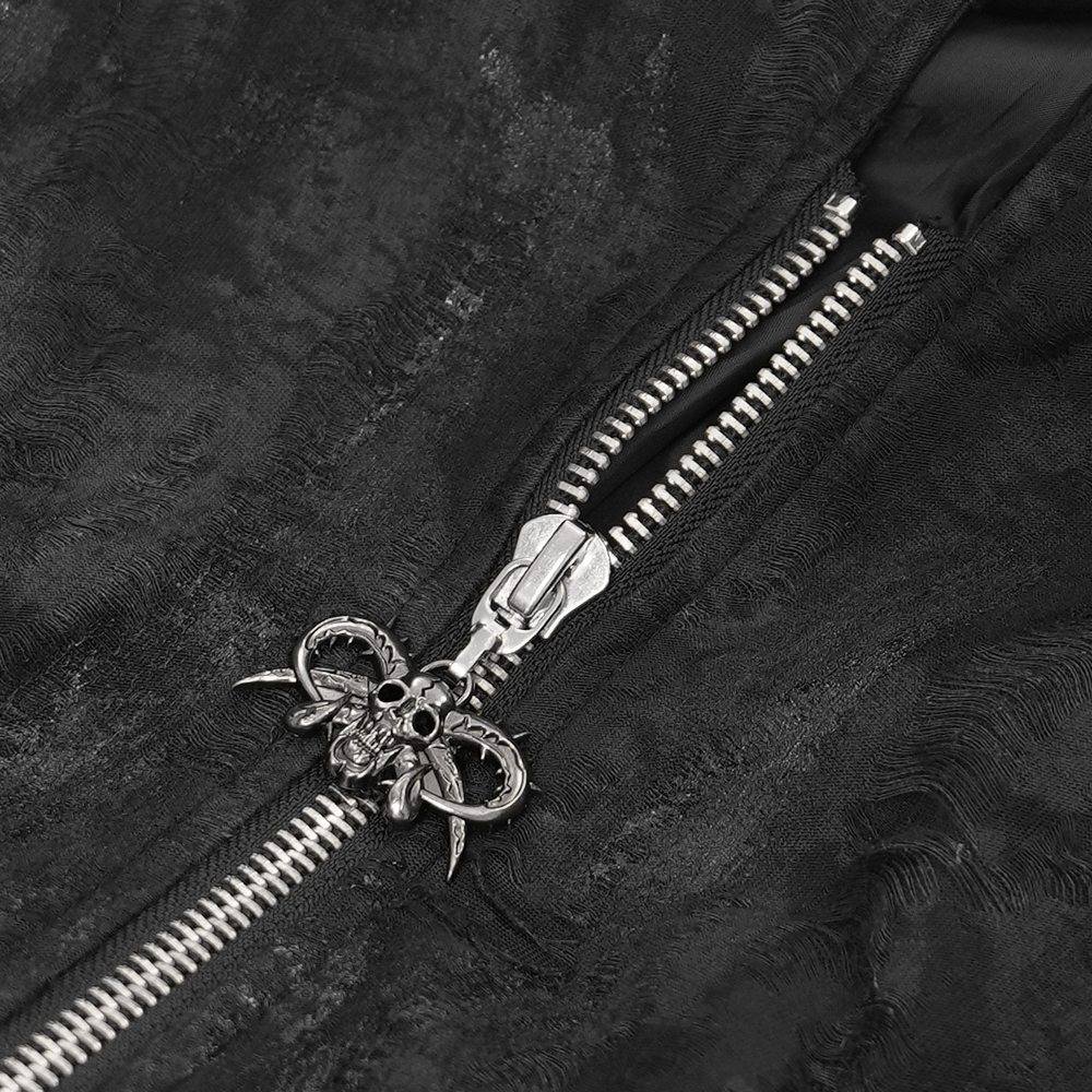 Close-up of the zippered closure on a men's gothic hooded coat featuring intricate skull and chain details.