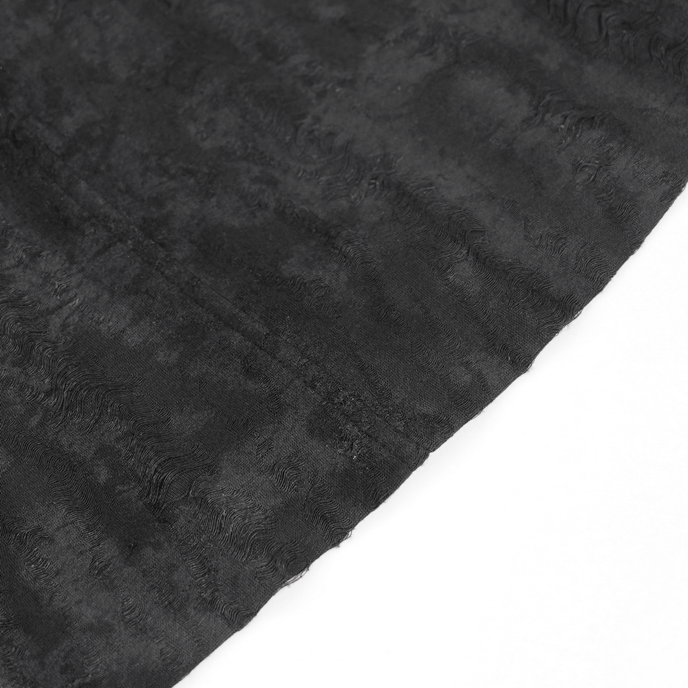 Textured dark fabric close-up, showcasing the premium material of a men’s gothic hooded coat.