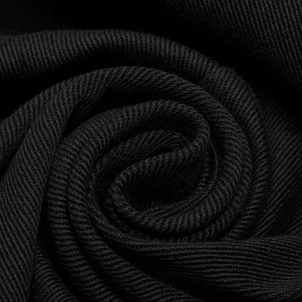 Close-up of black micro-elastic twill fabric, showcasing its luxurious texture and high-quality detail.