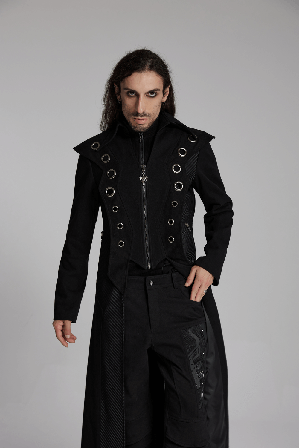 Stylish man in an avant-garde black men's punk long coat with metal accents and mesh details, exuding bold fashion vibes.