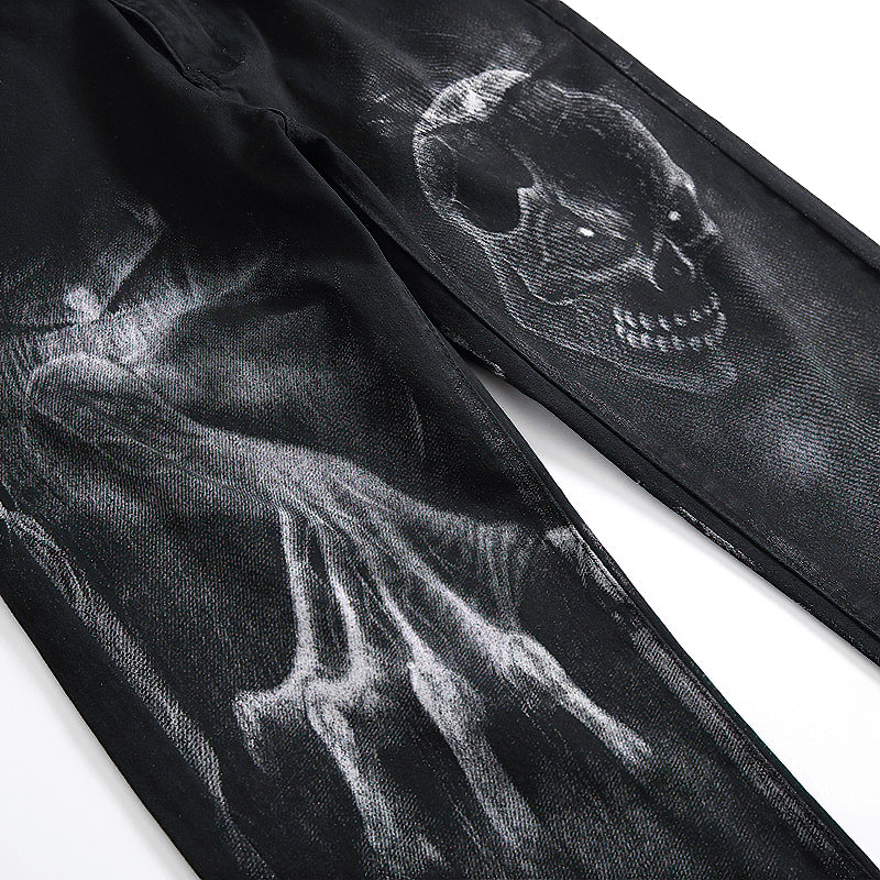 Men's 3D printed jeans featuring a dark skull and ghost hand print, stylish black denim streetwear.